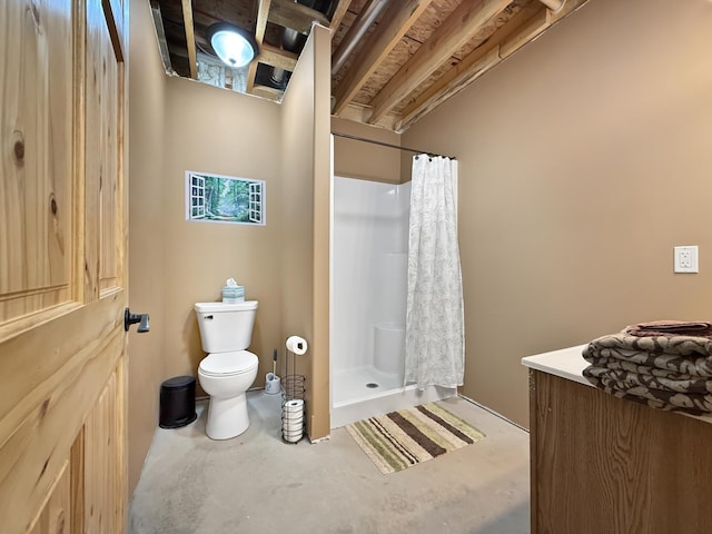 7215 Little Dip Ln NE, Bemidji, MN 56601 - bathroom with finished concrete floors, toilet, and a stall shower