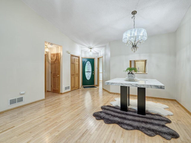 5420 Saxony Ct, White Bear Twp, MN 55110 - entrance foyer with light wood-style flooring, a chandelier, and baseboards