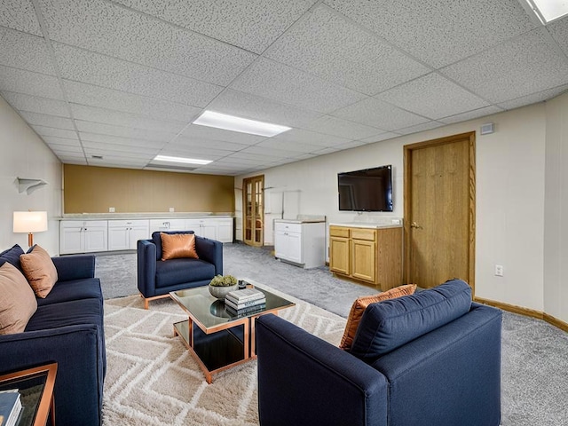 5420 Saxony Ct, White Bear Twp, MN 55110 - living area with light carpet, a drop ceiling, and baseboards
