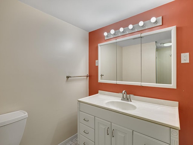5420 Saxony Ct, White Bear Twp, MN 55110 - bathroom with vanity, toilet, and baseboards