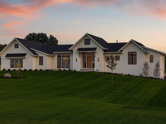 7937 Eldorado Rd, Credit River Twp, MN 55372 - modern inspired farmhouse featuring board and batten siding, a lawn, and a standing seam roof