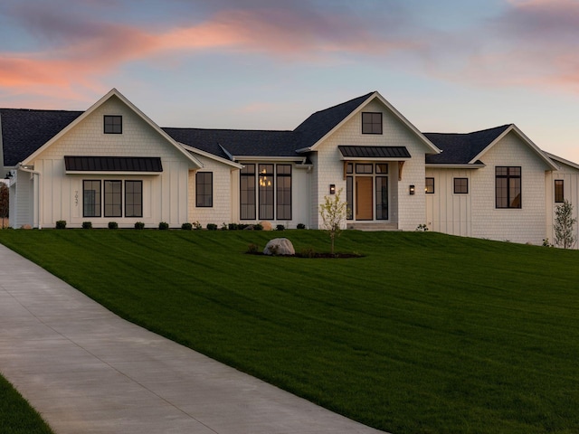 7937 Eldorado Rd, Credit River Twp, MN 55372 - modern farmhouse featuring board and batten siding, a lawn, a standing seam roof, metal roof, and a shingled roof