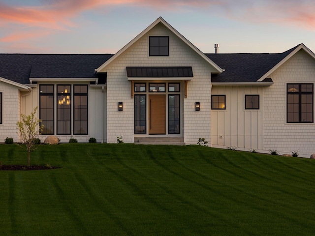 7937 Eldorado Rd, Credit River Twp, MN 55372 - modern farmhouse style home with a standing seam roof, a yard, a shingled roof, and metal roof