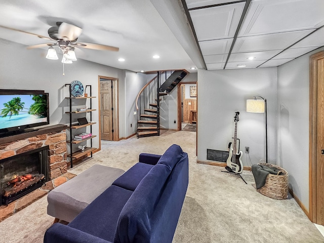 12216 175th St W, Lakeville, MN 55044 - carpeted living room featuring stairway, recessed lighting, a ceiling fan, baseboards, and a stone fireplace