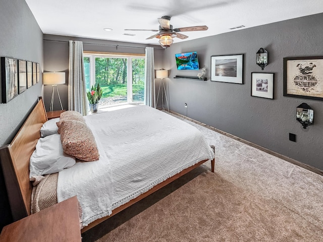 12216 175th St W, Lakeville, MN 55044 - carpeted bedroom featuring a textured wall, ceiling fan, and baseboards