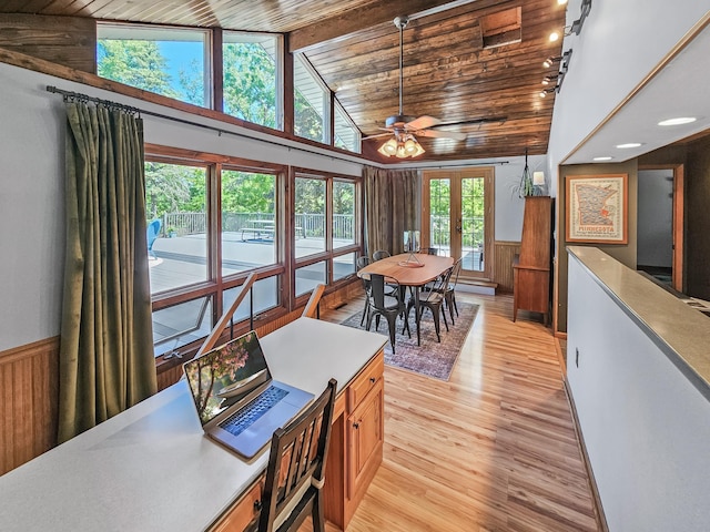 12216 175th St W, Lakeville, MN 55044 - dining space with french doors, wainscoting, light wood-style floors, ceiling fan, and wood ceiling with exposed beams