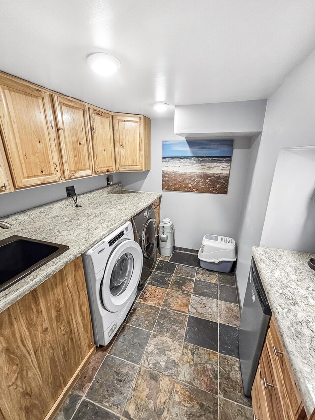 12216 175th St W, Lakeville, MN 55044 - washroom featuring washer / clothes dryer, stone tile flooring, and a sink