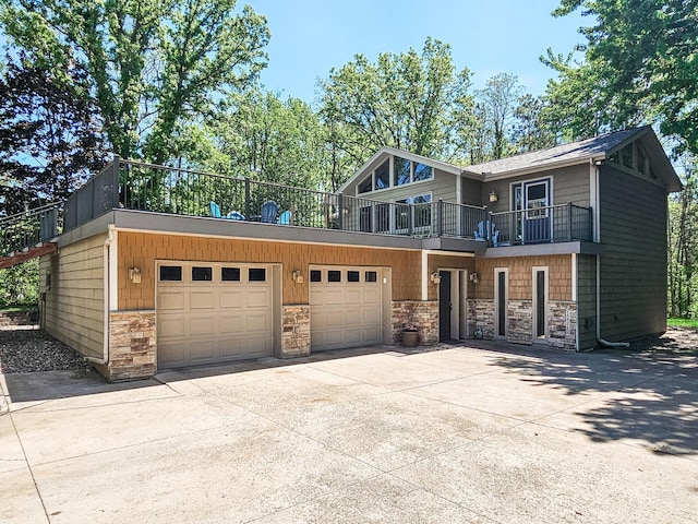 12216 175th St W, Lakeville, MN 55044 - view of front of property featuring a balcony, stone siding, driveway, and an attached garage