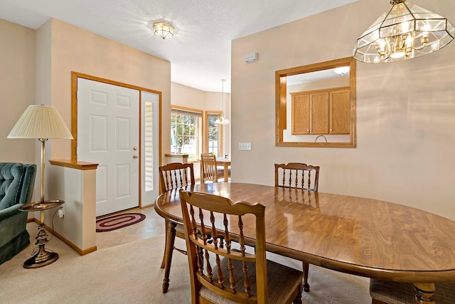 2990 David Cir, Little Canada, MN 55117 - dining room with a chandelier, light colored carpet, and baseboards