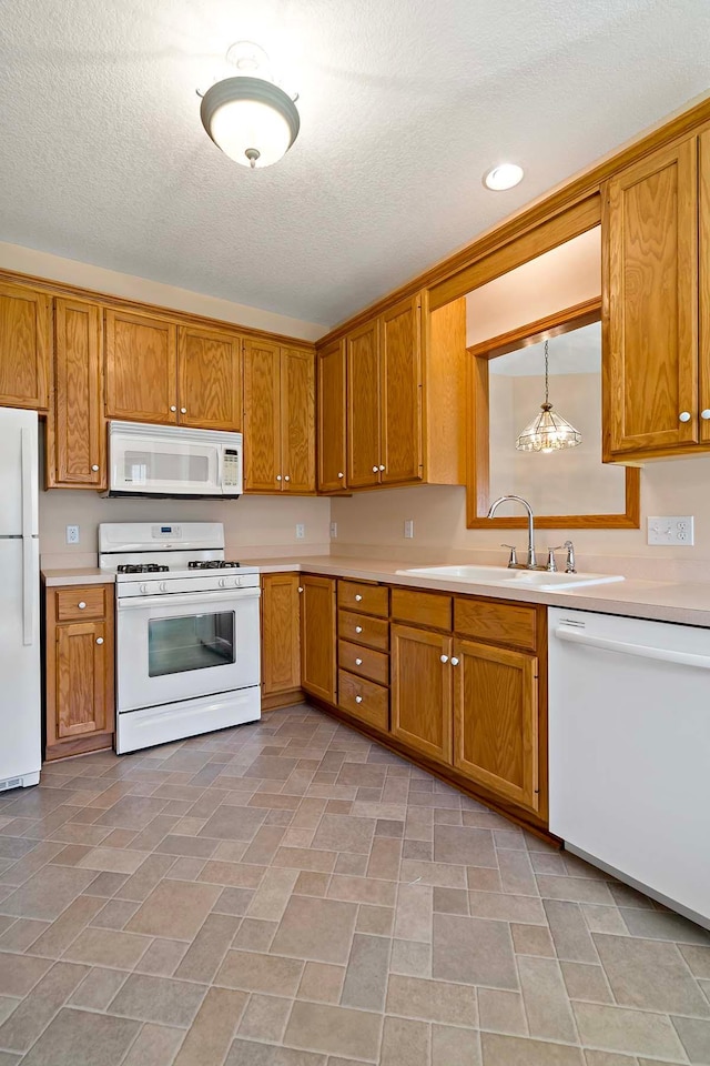 2990 David Cir, Little Canada, MN 55117 - kitchen featuring white appliances, a sink, light countertops, brown cabinetry, and a textured ceiling