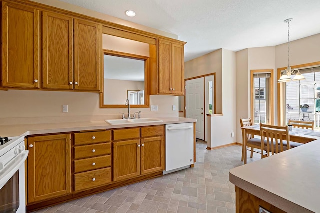 2990 David Cir, Little Canada, MN 55117 - kitchen featuring white appliances, a sink, brown cabinets, and decorative light fixtures