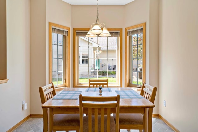 2990 David Cir, Little Canada, MN 55117 - dining room featuring baseboards and a chandelier