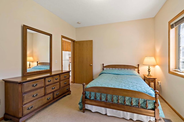 2990 David Cir, Little Canada, MN 55117 - bedroom featuring light carpet, baseboards, and freestanding refrigerator