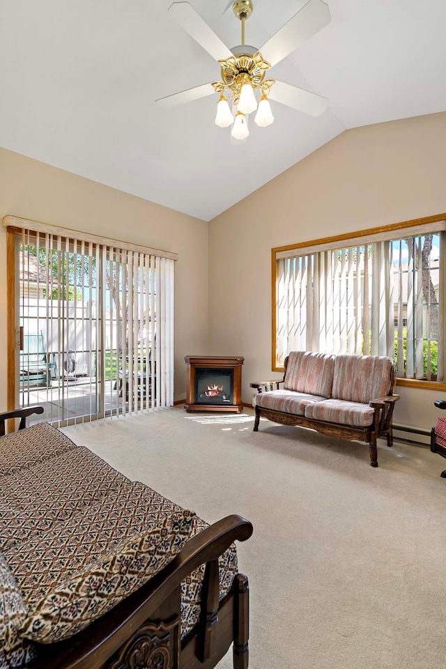 2990 David Cir, Little Canada, MN 55117 - carpeted bedroom with multiple windows, vaulted ceiling, a baseboard heating unit, and a glass covered fireplace