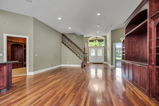 18141 87th Ave N, Maple Grove, MN 55311 - foyer entrance featuring wood finished floors, baseboards, recessed lighting, and stairway