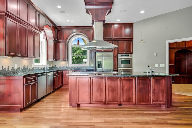 18141 87th Ave N, Maple Grove, MN 55311 - kitchen with dark brown cabinets, stainless steel appliances, light wood-style flooring, a sink, and recessed lighting