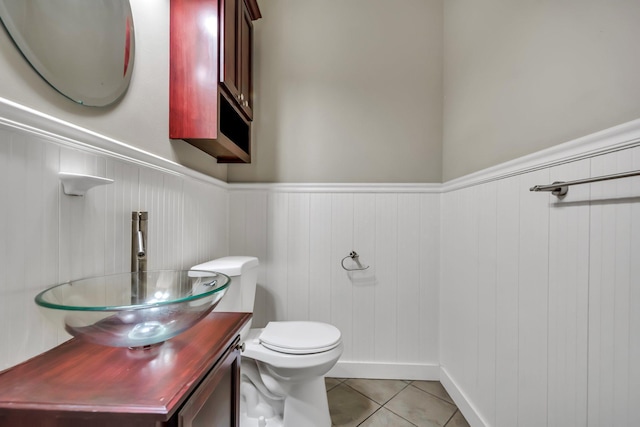 18141 87th Ave N, Maple Grove, MN 55311 - bathroom featuring wainscoting, toilet, vanity, and tile patterned floors
