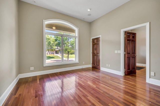 18141 87th Ave N, Maple Grove, MN 55311 - unfurnished room featuring hardwood / wood-style flooring and baseboards