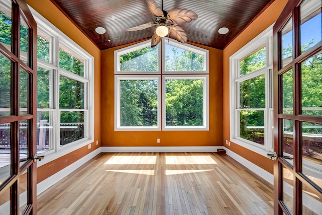 18141 87th Ave N, Maple Grove, MN 55311 - unfurnished sunroom with baseboards, lofted ceiling, wood finished floors, and healthy amount of natural light