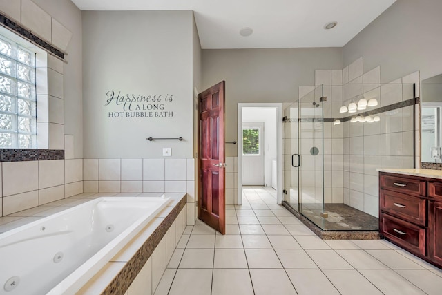 18141 87th Ave N, Maple Grove, MN 55311 - bathroom with a stall shower, a tub with jets, vanity, and tile patterned flooring
