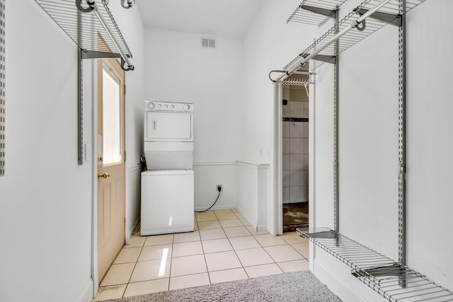 18141 87th Ave N, Maple Grove, MN 55311 - washroom with stacked washer and clothes dryer and light tile patterned floors