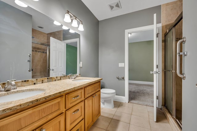 18141 87th Ave N, Maple Grove, MN 55311 - full bath with toilet, a stall shower, tile patterned flooring, double vanity, and baseboards