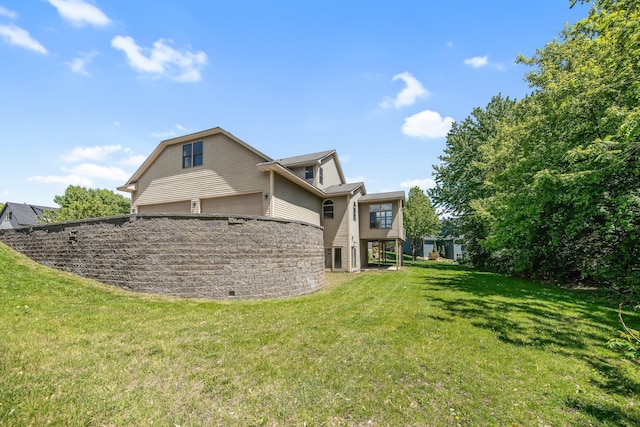 18141 87th Ave N, Maple Grove, MN 55311 - view of side of home with a lawn and a garage
