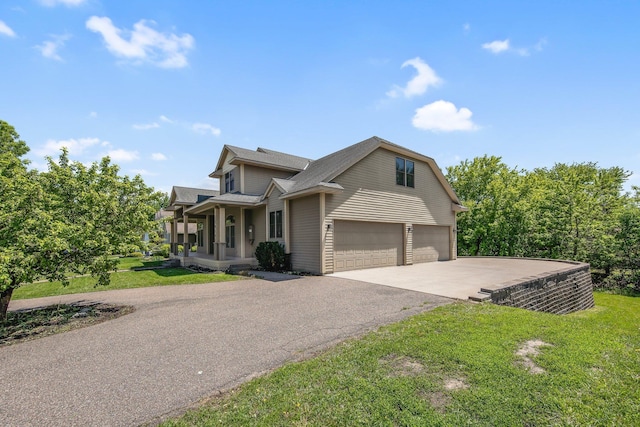 18141 87th Ave N, Maple Grove, MN 55311 - view of front of property with an attached garage, driveway, a front lawn, and a porch