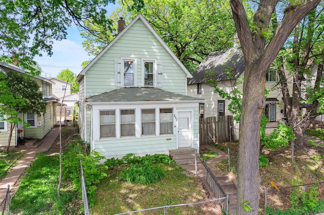 853 York Ave, Saint Paul, MN 55106 - view of front of property with a chimney and roof with shingles