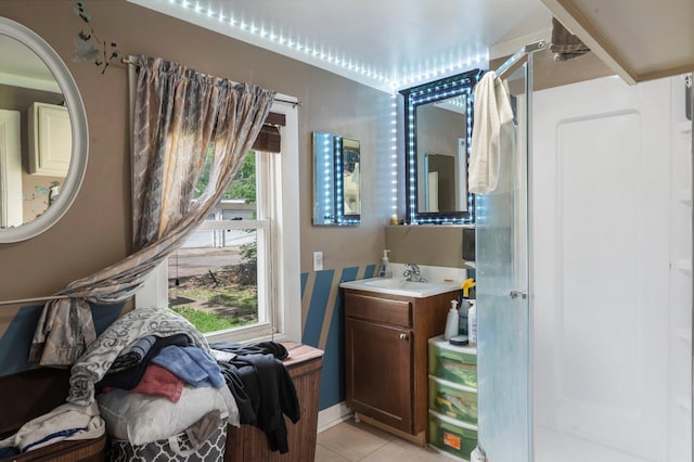 853 York Ave, Saint Paul, MN 55106 - bathroom featuring a shower stall, tile patterned floors, and vanity