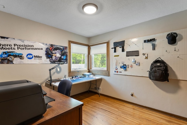 2196 Waukon Ave, Saint Paul, MN 55119 - home office featuring light wood-style floors, a textured ceiling, and baseboards