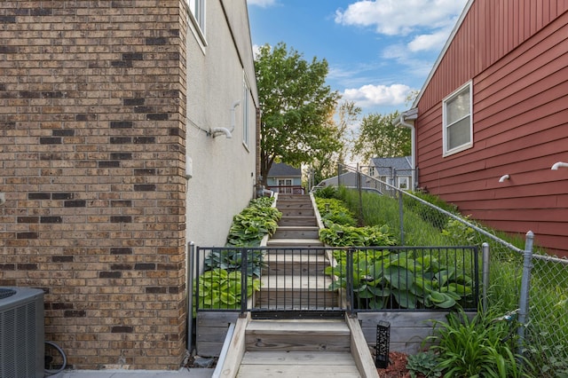 2196 Waukon Ave, Saint Paul, MN 55119 - exterior space featuring brick siding, central AC, and stucco siding