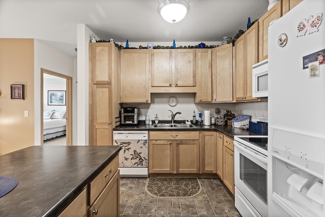 5445 Boone Ave N Unit 216, New Hope, MN 55428 - kitchen featuring white appliances, a sink, dark countertops, and light brown cabinets