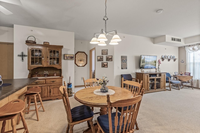 5445 Boone Ave N Unit 216, New Hope, MN 55428 - dining room with light carpet and a chandelier