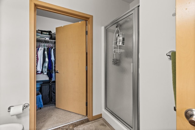 5445 Boone Ave N Unit 216, New Hope, MN 55428 - full bathroom with a stall shower, toilet, and a spacious closet