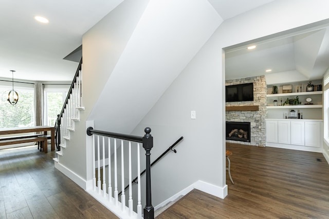9420 Fabian St NE, Kalmar Twp, MN 55920 - stairs featuring a chandelier, baseboards, wood finished floors, recessed lighting, and lofted ceiling