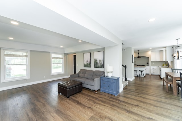 9420 Fabian St NE, Kalmar Twp, MN 55920 - living area with baseboards, dark wood finished floors, recessed lighting, and a chandelier