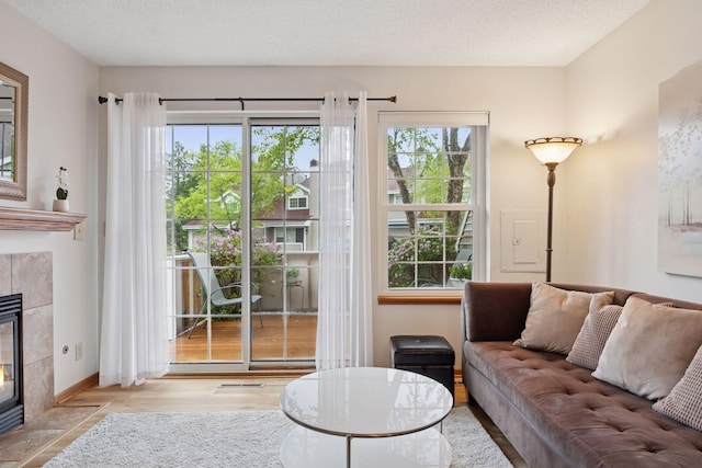 1925 Shenandoah Ct Unit G, Plymouth, MN 55447 - living area featuring a tile fireplace and wood finished floors