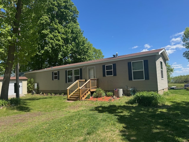 39872 Moose Ln, Wahkon, MN 56386 - rear view of property with crawl space, a lawn, and central AC unit