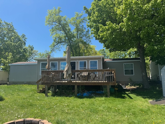39872 Moose Ln, Wahkon, MN 56386 - rear view of property with a deck, a lawn, and crawl space
