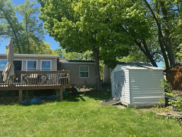 39872 Moose Ln, Wahkon, MN 56386 - rear view of house featuring a deck and a lawn