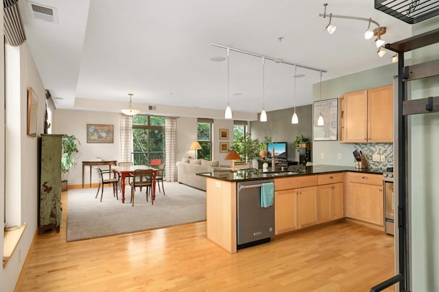4500 Chicago Ave Unit 311, Minneapolis, MN 55407 - kitchen with appliances with stainless steel finishes, light wood-style floors, and light brown cabinetry
