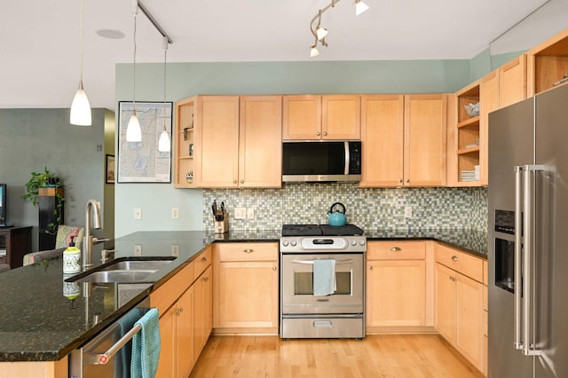 4500 Chicago Ave Unit 311, Minneapolis, MN 55407 - kitchen featuring stainless steel appliances, open shelves, light brown cabinetry, and a peninsula