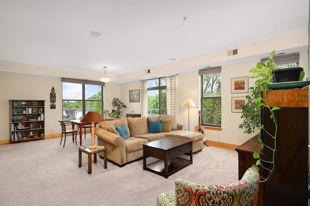 4500 Chicago Ave Unit 311, Minneapolis, MN 55407 - living room with light colored carpet, baseboards, and healthy amount of natural light