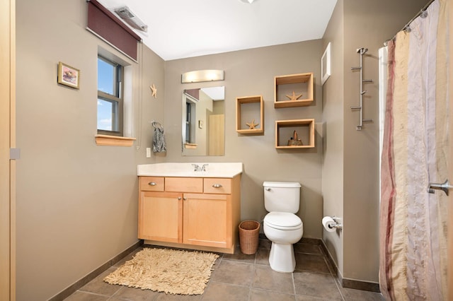 4500 Chicago Ave Unit 311, Minneapolis, MN 55407 - full bath with toilet, vanity, tile patterned flooring, and baseboards