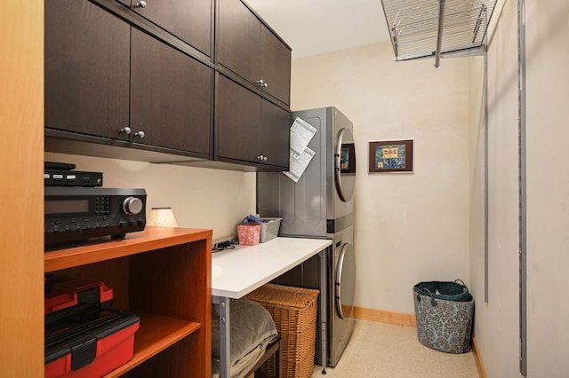 4500 Chicago Ave Unit 311, Minneapolis, MN 55407 - laundry room featuring estacked washer and dryer, tile patterned floors, and baseboards