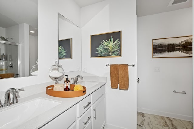 11695 72nd St NE, Otsego, MN 55301 - bathroom featuring a shower stall, marble finish flooring, double vanity, and baseboards