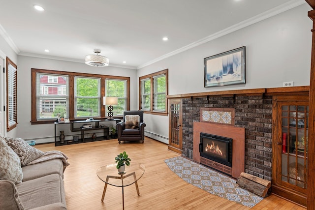 3812 Elliot Ave, Minneapolis, MN 55407 - living area featuring baseboard heating, wood finished floors, a fireplace, recessed lighting, and ornamental molding