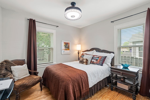 3812 Elliot Ave, Minneapolis, MN 55407 - bedroom with multiple windows and light wood-style flooring