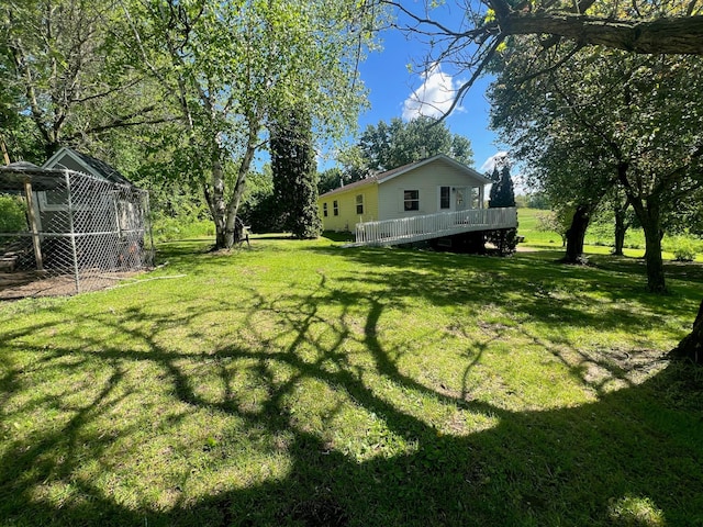 S363 Nicholes Rd, Naples Twp, WI 54755 - view of grassy yard featuring a deck